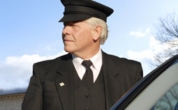 A limousine chauffeur driver