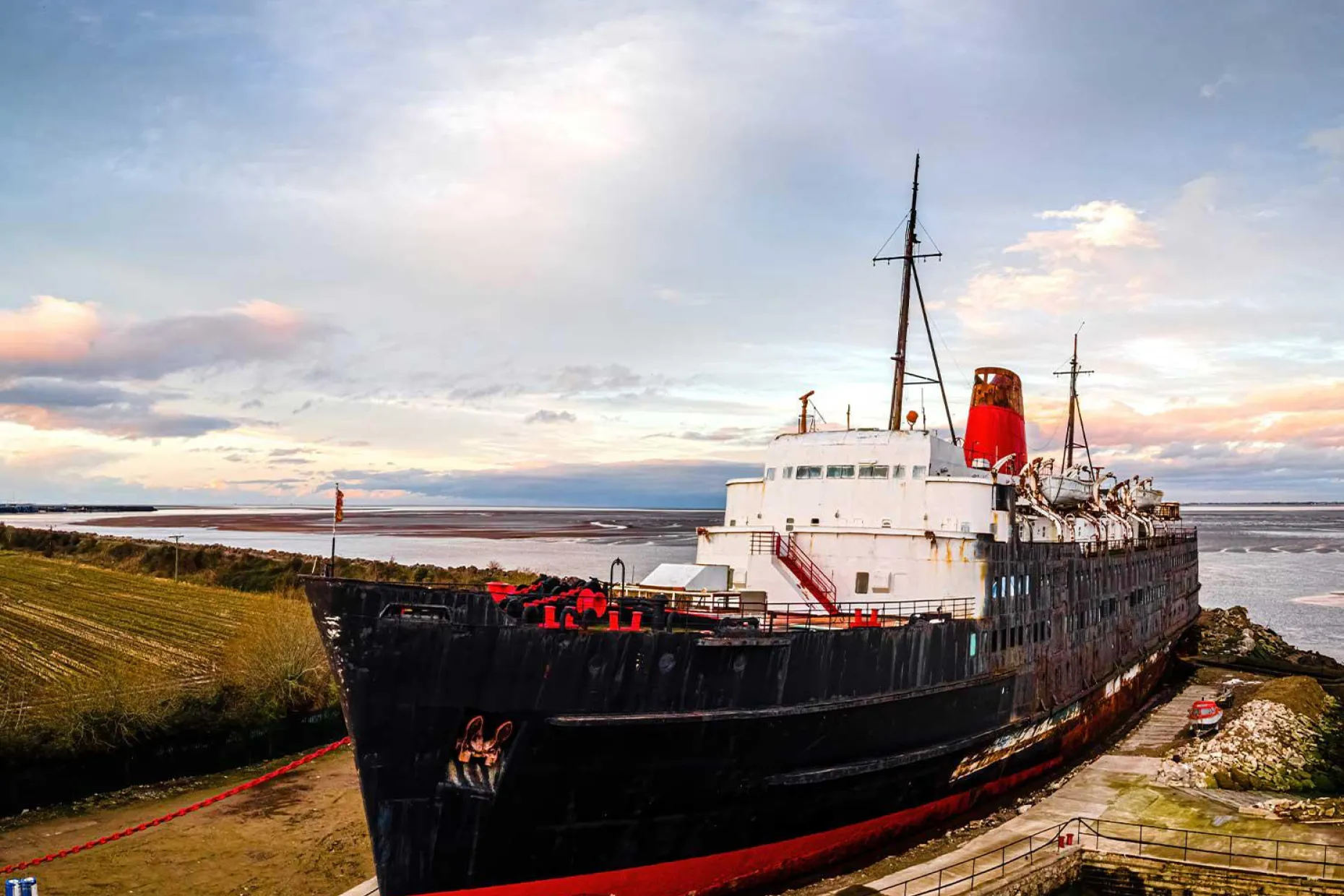 A black and red boat at Dukes Moor near W. S. Harrison in Gosforth